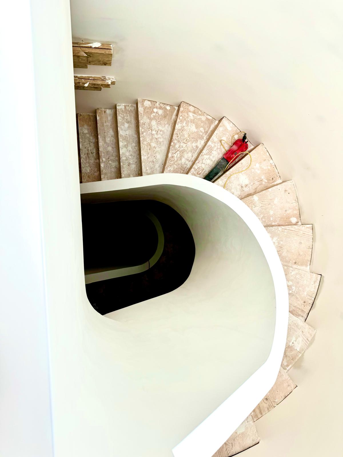 Spiral staircase with curved drywall bulkhead